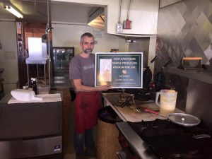 Patrick Connor of the highly rated Intervale Farm Pancake House and longtime host of the Henniker NHMPA Regional Meeting with his new membership sign